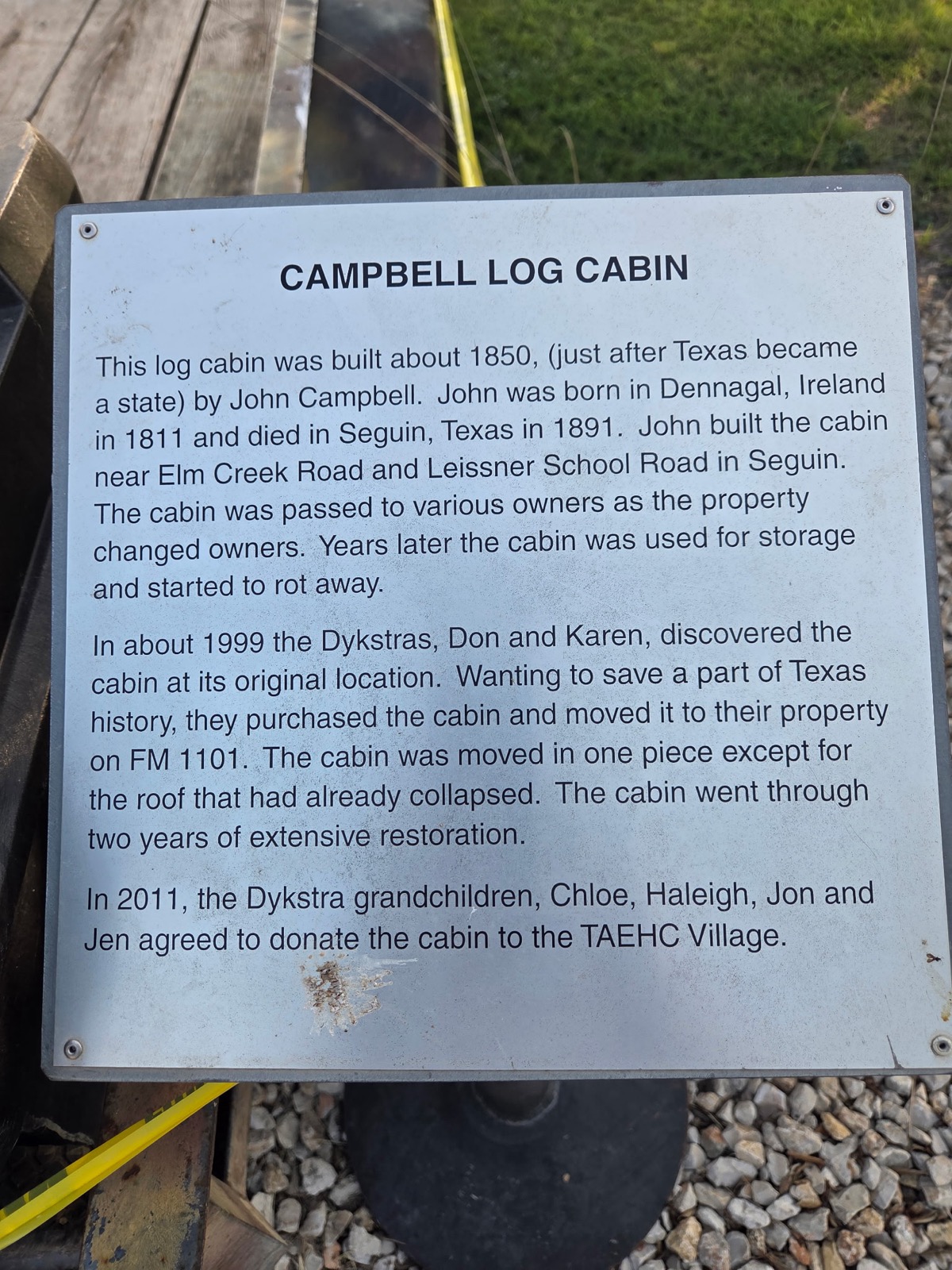 Historical marker telling the story of the Campbell Log Cabin