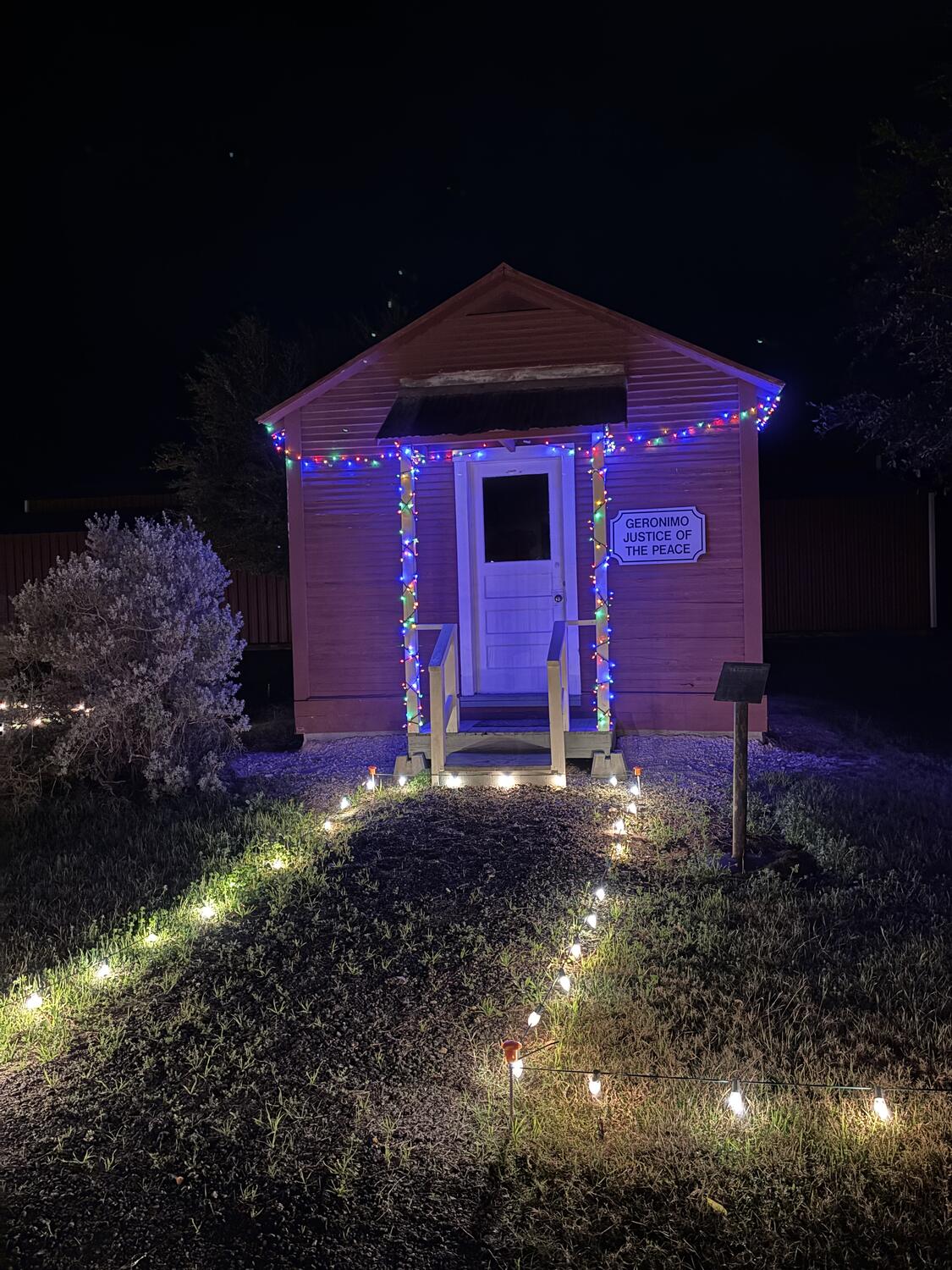 The Geronimo Justice of the Peace building outlined in Christmas lights