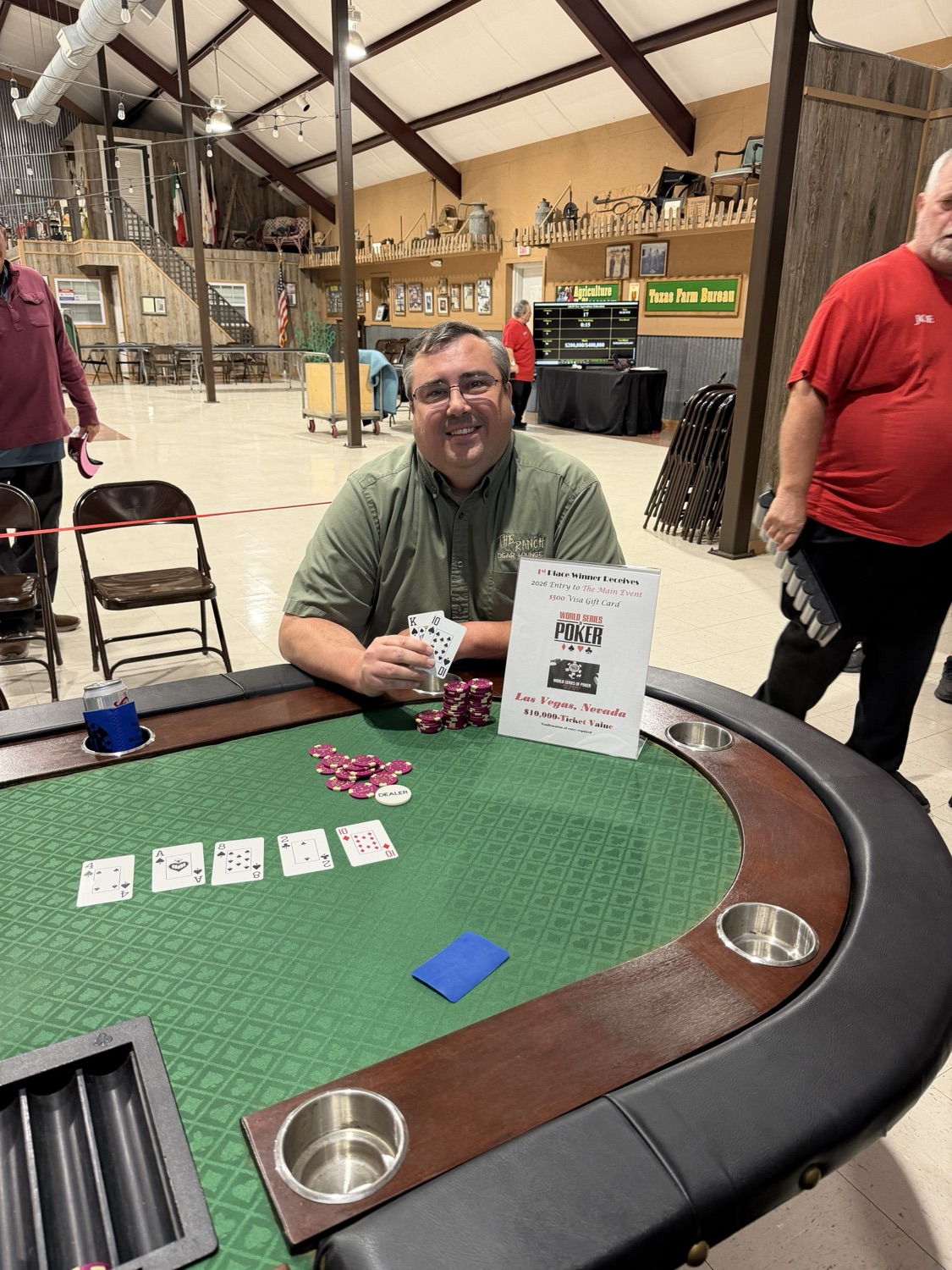 Champion Radd Blackburn at the final poker table holding his winning hand